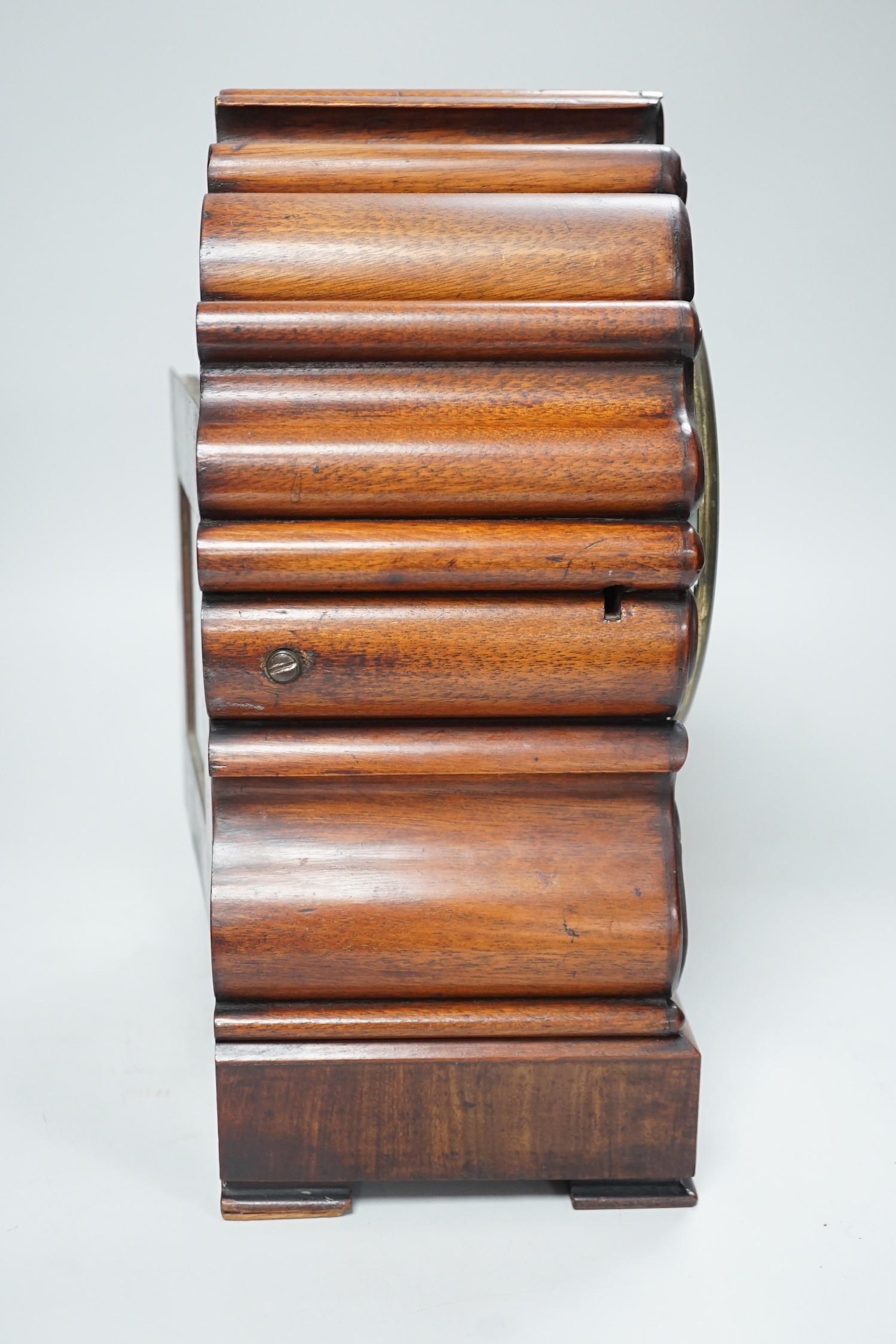 Mason, Ipswich. A 19th century mahogany cased mantel clock with scrolling moulded decoration - 31cm tall